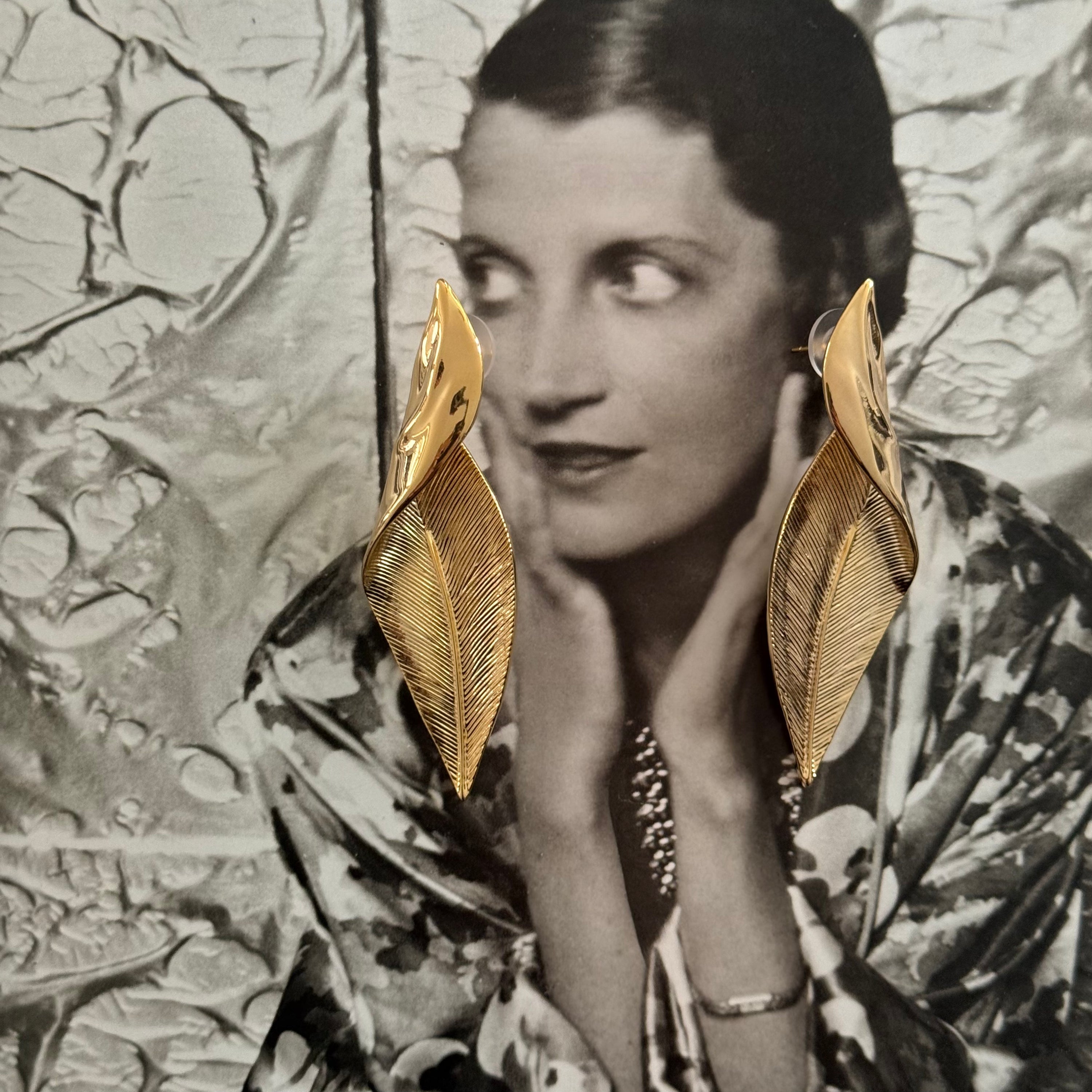 Long Gold toned Leaf Shaped Textured Pierced Earrings