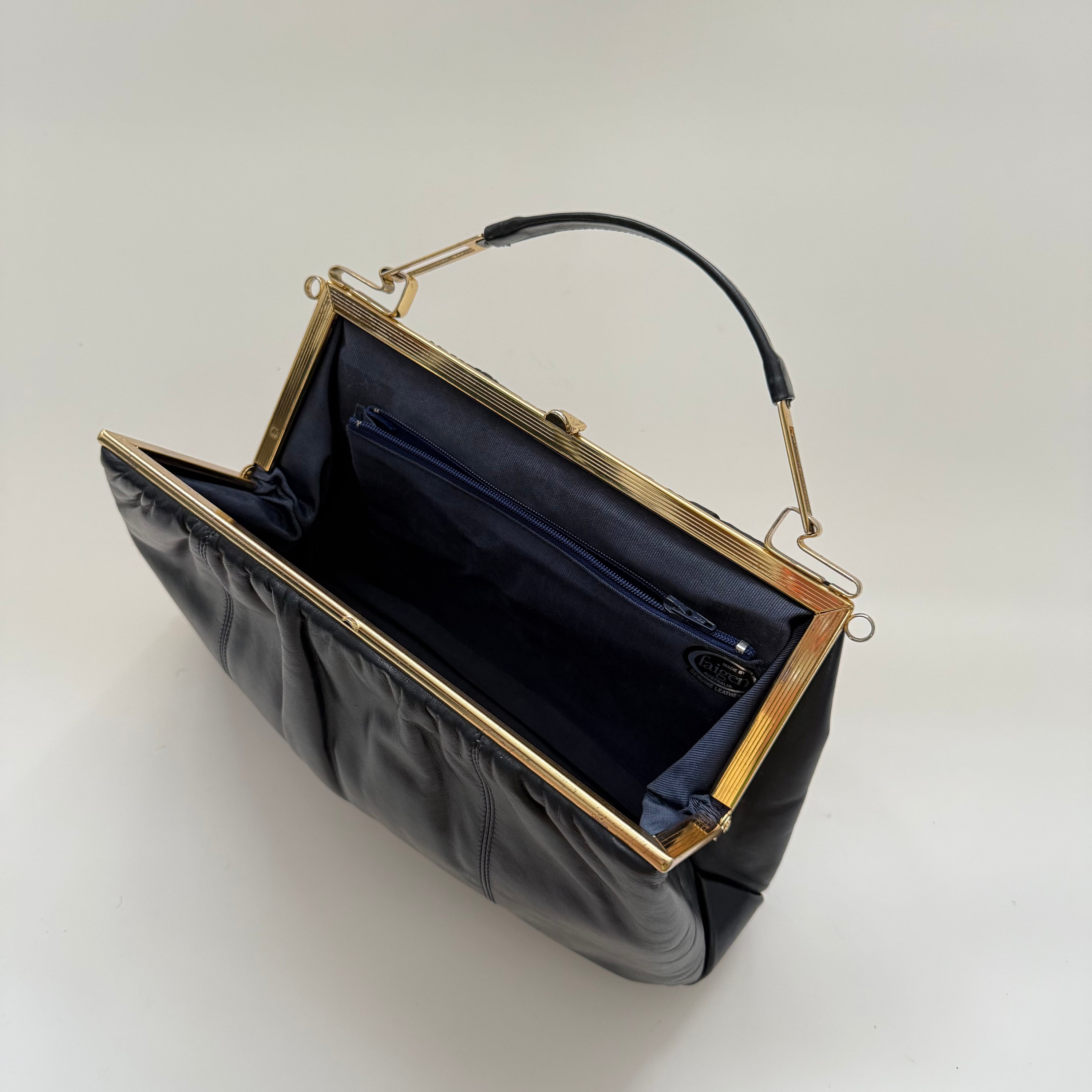 Vintage 70s Faigen Navy Leather Purse with Unique Sculptural Gold toned Top Handle