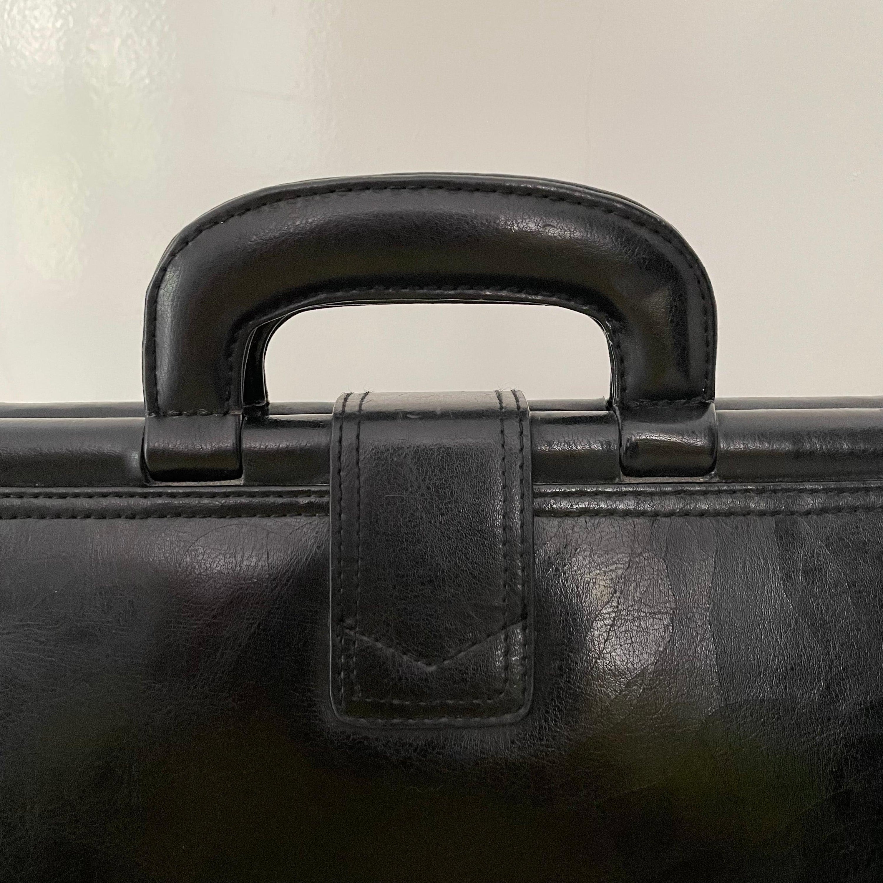 Vintage 1980s signed Lanza Black Leather bag with push lock button - WŪHAŪS